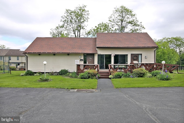 220 Brian Dr, Enola, PA 17025 - view of front facade featuring a wooden deck and a front yard