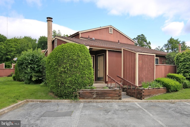 220 Brian Dr, Enola, PA 17025 - view of front facade featuring a front lawn and a shingled roof