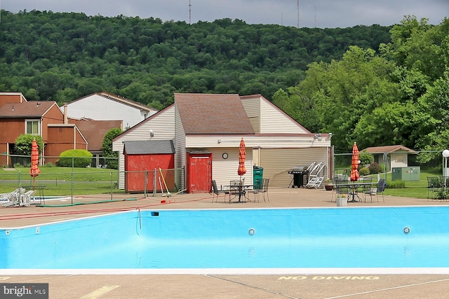 220 Brian Dr, Enola, PA 17025 - community pool with fence, a wooded view, and a patio