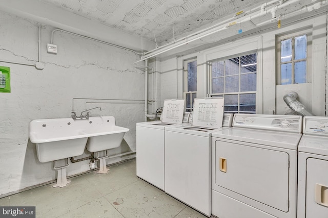 1026 16th St NW Unit 505, Washington, DC 20036 - laundry room featuring washing machine and clothes dryer and a sink