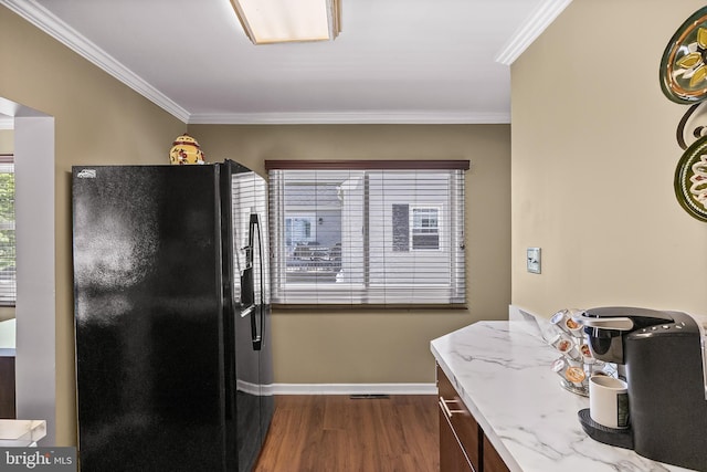 74 N Chester Ave, Riverside, NJ 08075 - kitchen featuring black fridge with ice dispenser, dark wood-type flooring, ornamental molding, baseboards, and light stone counters