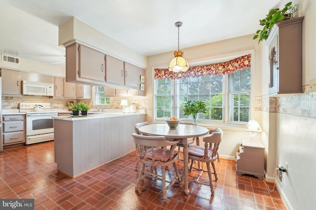 15320 Durant St, Silver Spring, MD 20905 - dining space with brick patterned flooring and baseboards