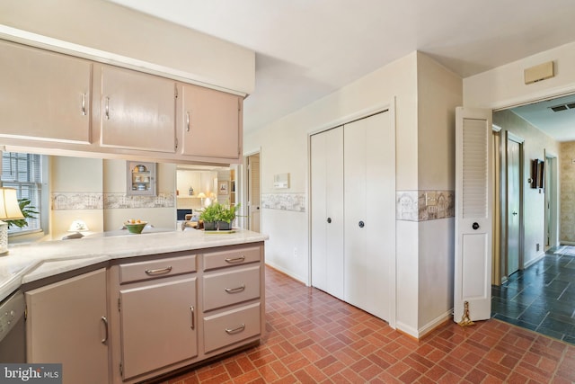 15320 Durant St, Silver Spring, MD 20905 - kitchen with brick patterned floors and light countertops