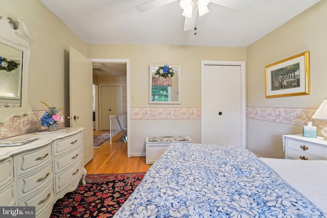 15320 Durant St, Silver Spring, MD 20905 - bedroom featuring a wainscoted wall, light wood finished floors, a closet, and ceiling fan
