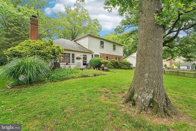 15320 Durant St, Silver Spring, MD 20905 - rear view of house with a chimney and brick siding