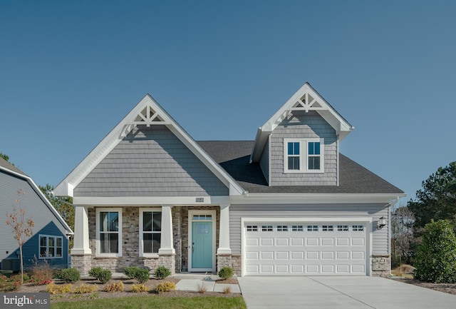 36531 Burleson Dr, Frankford, DE 19945 - craftsman inspired home with concrete driveway, stone siding, and a shingled roof