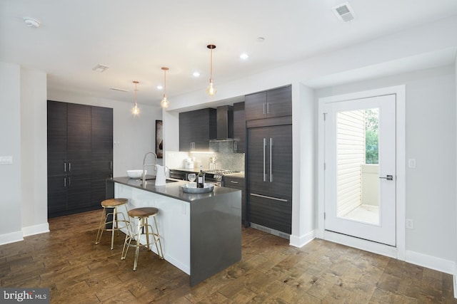 1212 E Susquehanna Ave Unit D, Philadelphia, PA 19125 - kitchen with wall chimney range hood, a sink, dark countertops, modern cabinets, and recessed lighting
