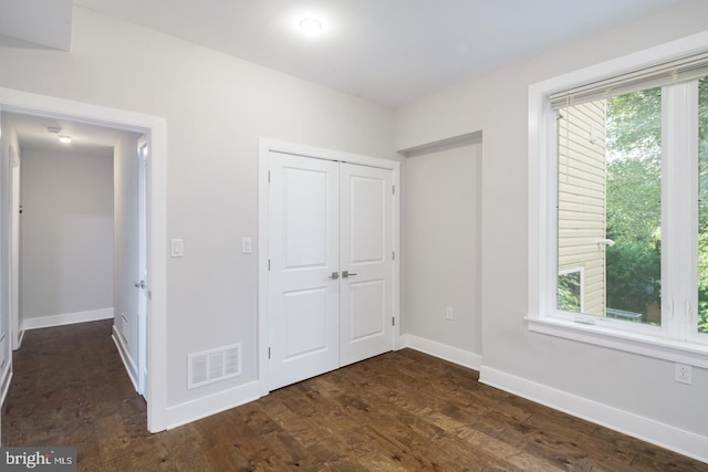 1212 E Susquehanna Ave Unit D, Philadelphia, PA 19125 - unfurnished bedroom featuring baseboards, a closet, and dark wood finished floors