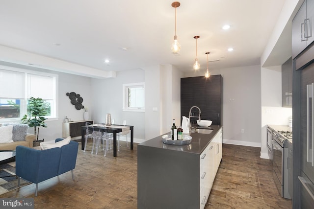1212 E Susquehanna Ave Unit D, Philadelphia, PA 19125 - kitchen with a sink, stainless steel gas range oven, modern cabinets, healthy amount of natural light, and recessed lighting