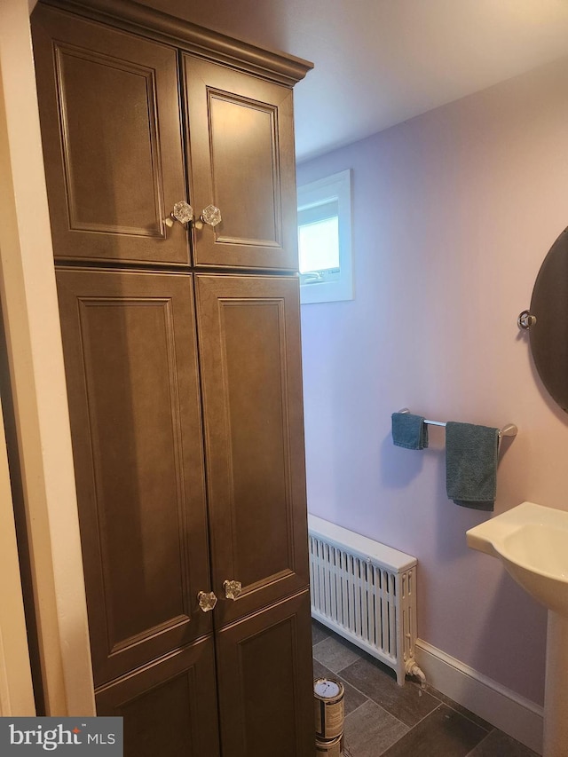 detailed view of radiator and baseboards