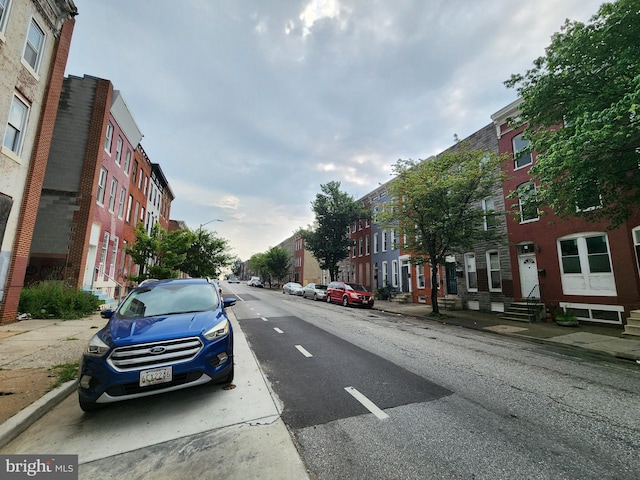 1000 E Preston St, Baltimore, MD 21202 - view of asphalt street with sidewalks, street lights, curbs, and a residential view