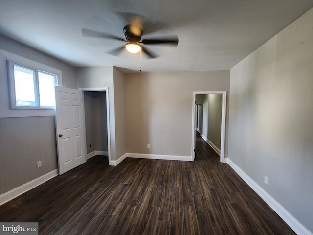 1000 E Preston St, Baltimore, MD 21202 - empty room with dark wood finished floors, a ceiling fan, and baseboards