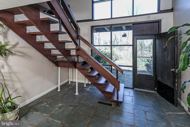 70 Heather Ln, Princeton, NJ 08540 - foyer entrance featuring stone tile flooring, baseboards, and stairs