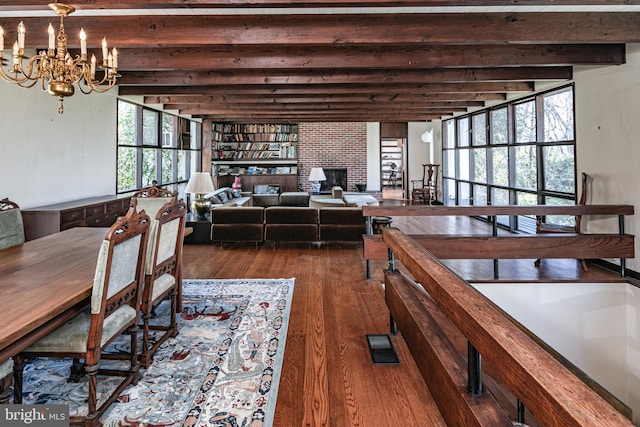 70 Heather Ln, Princeton, NJ 08540 - dining room featuring dark wood-type flooring, beamed ceiling, a chandelier, and a fireplace