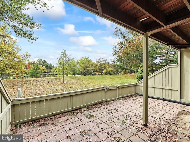 unfurnished sunroom with view of scattered trees