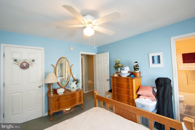 5294 Bucktown Rd, Cambridge, MD 21613 - bedroom with carpet floors, connected bathroom, and ceiling fan