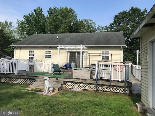 5294 Bucktown Rd, Cambridge, MD 21613 - back of property with a pergola, a lawn, a wooden deck, and roof with shingles