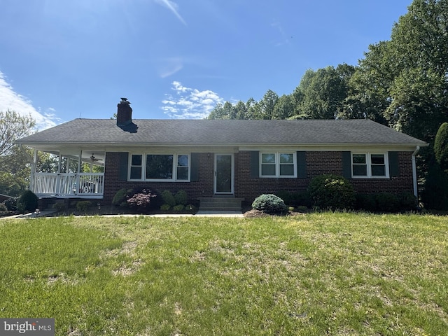 15510 Baden Naylor Rd, Brandywine, MD 20613 - view of front of home with a chimney, a front yard, brick siding, and entry steps