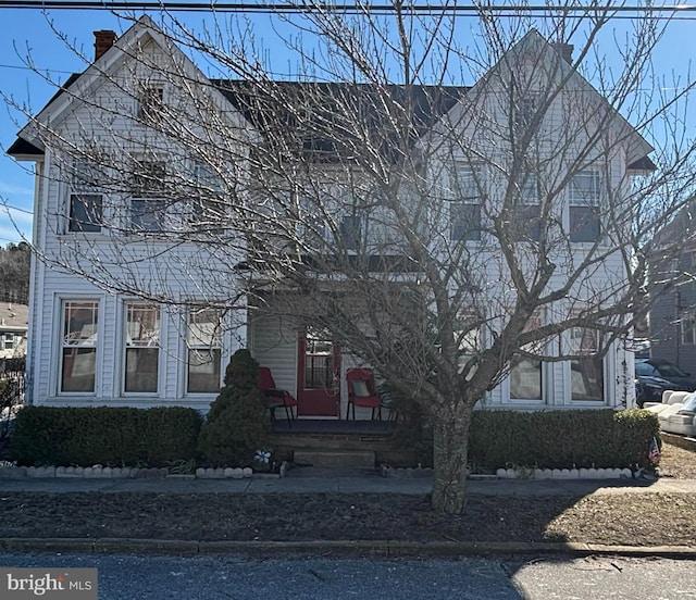 303 Main St, Ellendale, DE 19941 - view of front of home featuring a chimney
