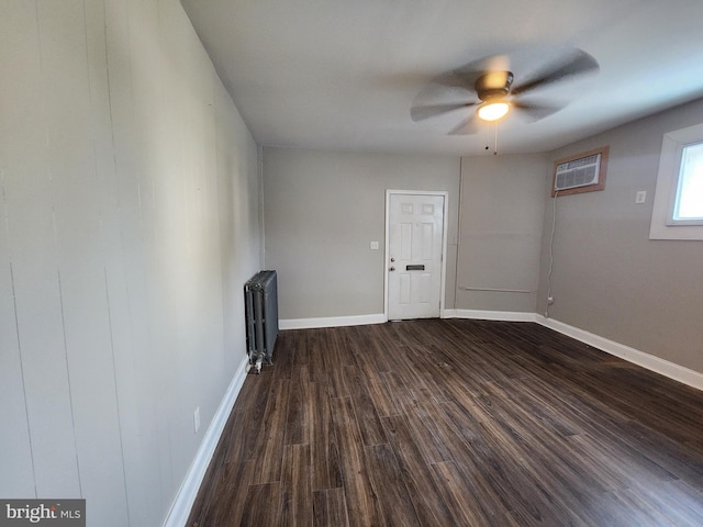 1000 E Preston St, Baltimore, MD 21202 - spare room with radiator, an AC wall unit, dark wood-style floors, and ceiling fan