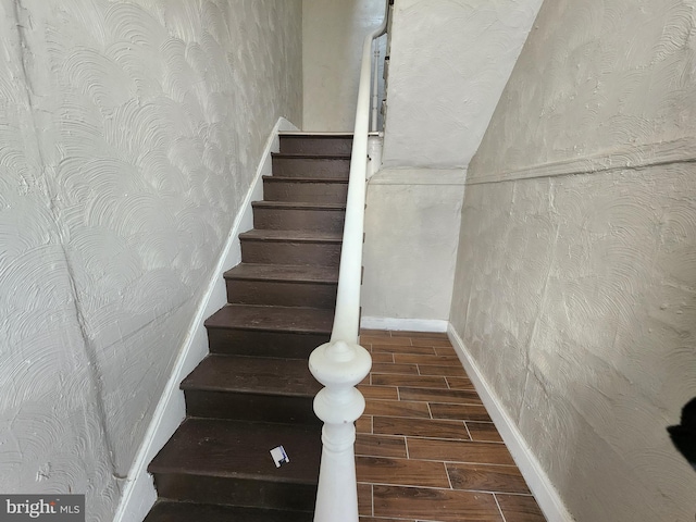 1000 E Preston St, Baltimore, MD 21202 - stairs with wood tiled floors and baseboards