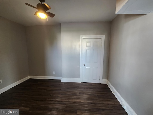 1000 E Preston St, Baltimore, MD 21202 - unfurnished room featuring a ceiling fan, dark wood-type flooring, and baseboards