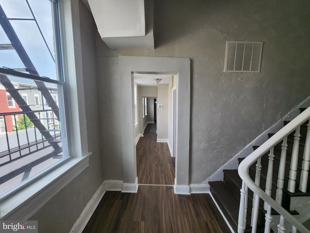 1000 E Preston St, Baltimore, MD 21202 - hall with wood finished floors, baseboards, and stairs