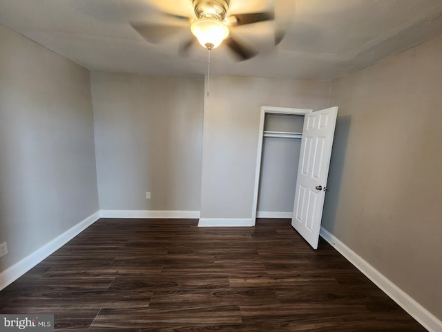 1000 E Preston St, Baltimore, MD 21202 - unfurnished bedroom with dark wood finished floors, baseboards, a ceiling fan, and a closet