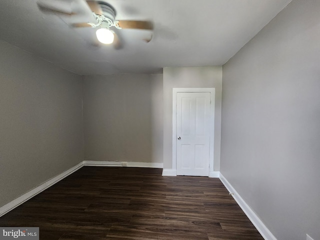 1000 E Preston St, Baltimore, MD 21202 - unfurnished room featuring dark wood-style floors, baseboards, and a ceiling fan