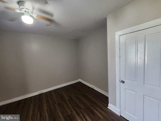 1000 E Preston St, Baltimore, MD 21202 - unfurnished room with baseboards, dark wood-style flooring, and a ceiling fan