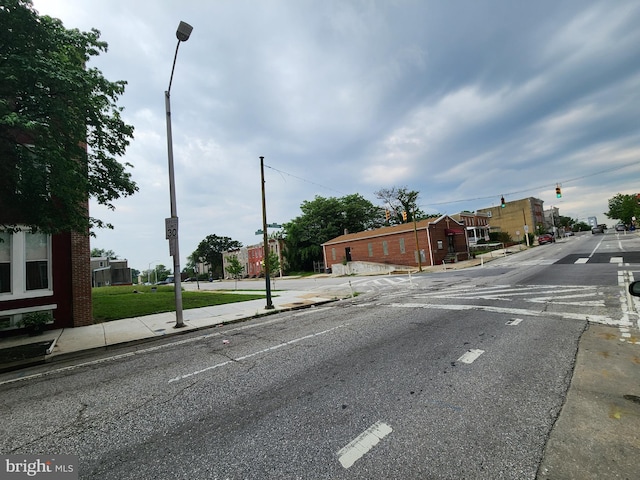 1000 E Preston St, Baltimore, MD 21202 - view of asphalt street featuring sidewalks, curbs, traffic lights, and street lighting