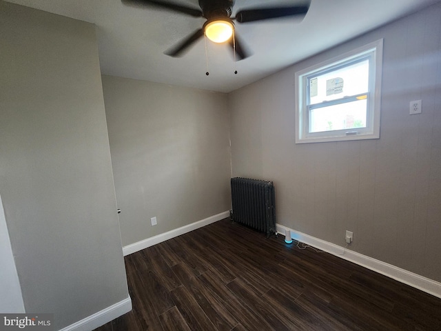 1000 E Preston St, Baltimore, MD 21202 - empty room with radiator, dark wood-type flooring, baseboards, and a ceiling fan