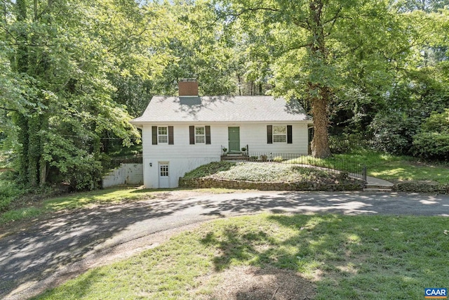 1340 Hilltop Rd, Charlottesville, VA 22903 - view of front facade with a chimney and asphalt driveway
