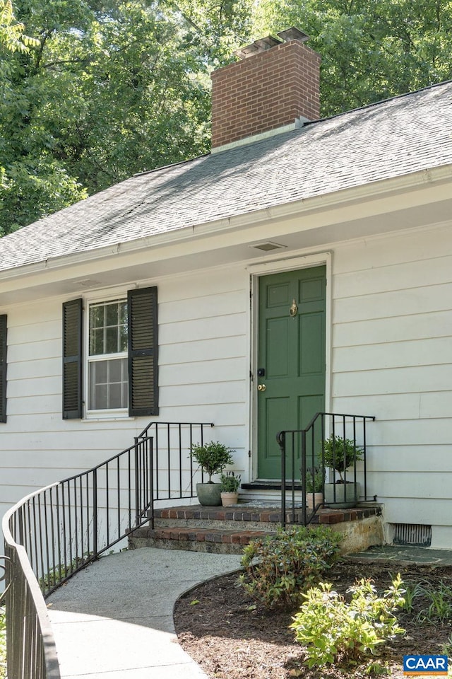 1340 Hilltop Rd, Charlottesville, VA 22903 - property entrance featuring a chimney and a shingled roof