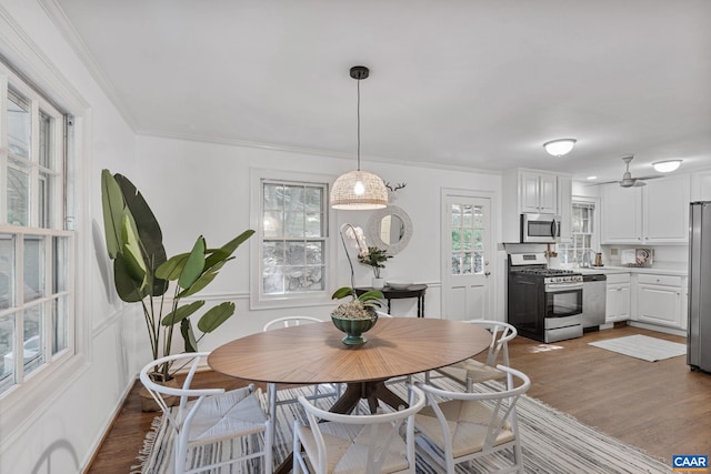 1340 Hilltop Rd, Charlottesville, VA 22903 - dining space with wood finished floors, ornamental molding, and a ceiling fan