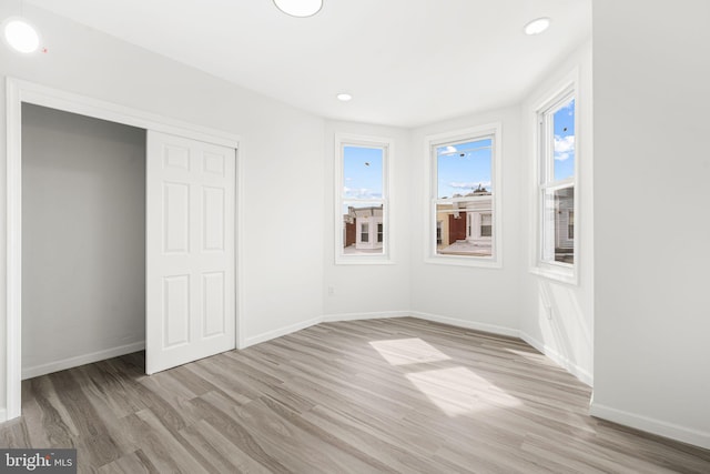 5514 Broomall St, Philadelphia, PA 19143 - unfurnished bedroom with light wood-style flooring, baseboards, recessed lighting, and a closet