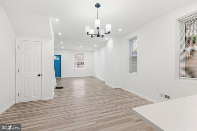 5514 Broomall St, Philadelphia, PA 19143 - unfurnished dining area with a chandelier, light wood-style flooring, baseboards, and recessed lighting