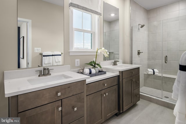 6609 Cowley St, Middle River, MD 21220 - full bath featuring a stall shower, two vanities, and tile patterned flooring