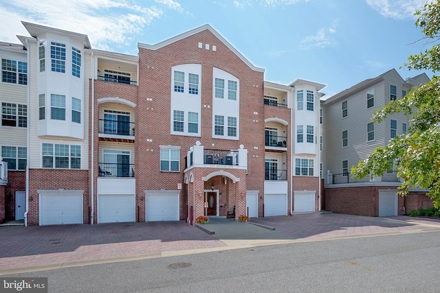 7305 Brookview Rd Unit 207, Elkridge, MD 21075 - view of property with driveway and an attached garage