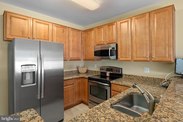 7305 Brookview Rd Unit 207, Elkridge, MD 21075 - kitchen with stainless steel appliances, a sink, and dark stone counters