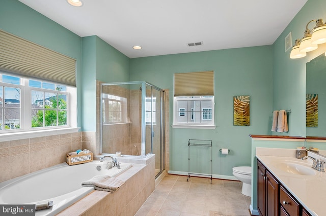 7305 Brookview Rd Unit 207, Elkridge, MD 21075 - bathroom featuring vanity, a garden tub, a stall shower, toilet, and baseboards