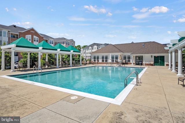 7305 Brookview Rd Unit 207, Elkridge, MD 21075 - community pool with a patio area, a gazebo, and a residential view