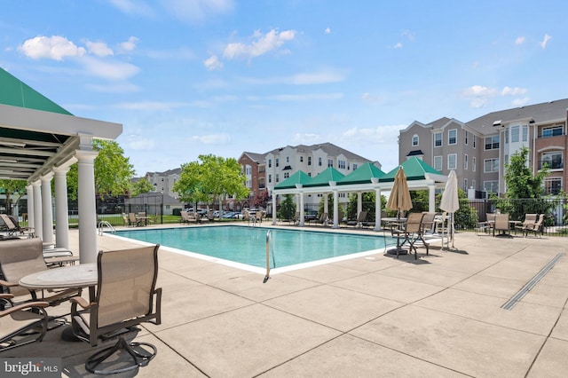 7305 Brookview Rd Unit 207, Elkridge, MD 21075 - community pool with a patio area and a residential view