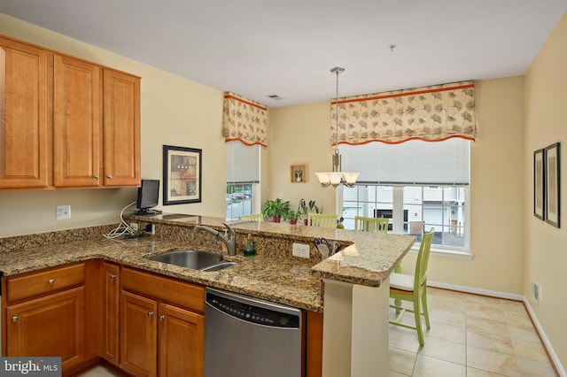 7305 Brookview Rd Unit 207, Elkridge, MD 21075 - kitchen featuring stainless steel dishwasher, a sink, a peninsula, and brown cabinets