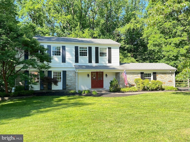 1027 Hart Rd, Baltimore, MD 21286 - traditional-style house with stone siding and a front lawn