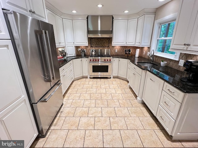 1027 Hart Rd, Baltimore, MD 21286 - kitchen with premium appliances, wall chimney range hood, a sink, recessed lighting, and backsplash