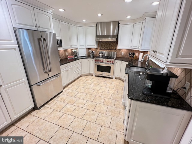 1027 Hart Rd, Baltimore, MD 21286 - kitchen with stainless steel appliances, wall chimney exhaust hood, a sink, light tile patterned flooring, and dark stone counters