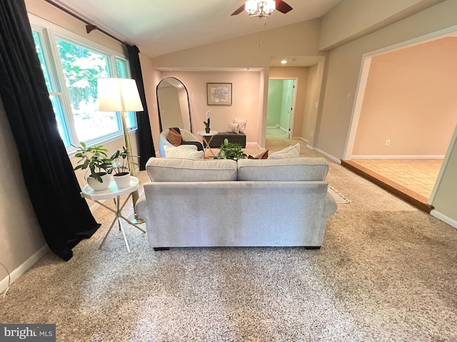 1027 Hart Rd, Baltimore, MD 21286 - living room featuring lofted ceiling, a ceiling fan, arched walkways, and baseboards