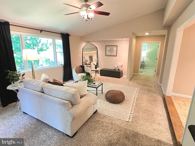 1027 Hart Rd, Baltimore, MD 21286 - living room featuring ceiling fan, light carpet, vaulted ceiling, arched walkways, and baseboards