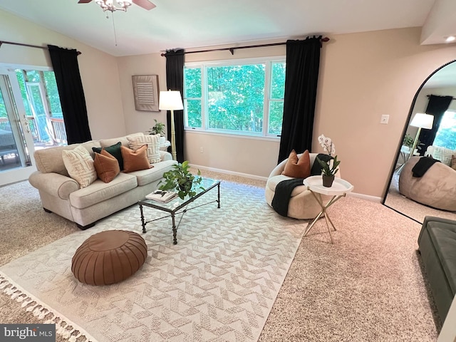 1027 Hart Rd, Baltimore, MD 21286 - living area with ceiling fan, carpet flooring, baseboards, and lofted ceiling